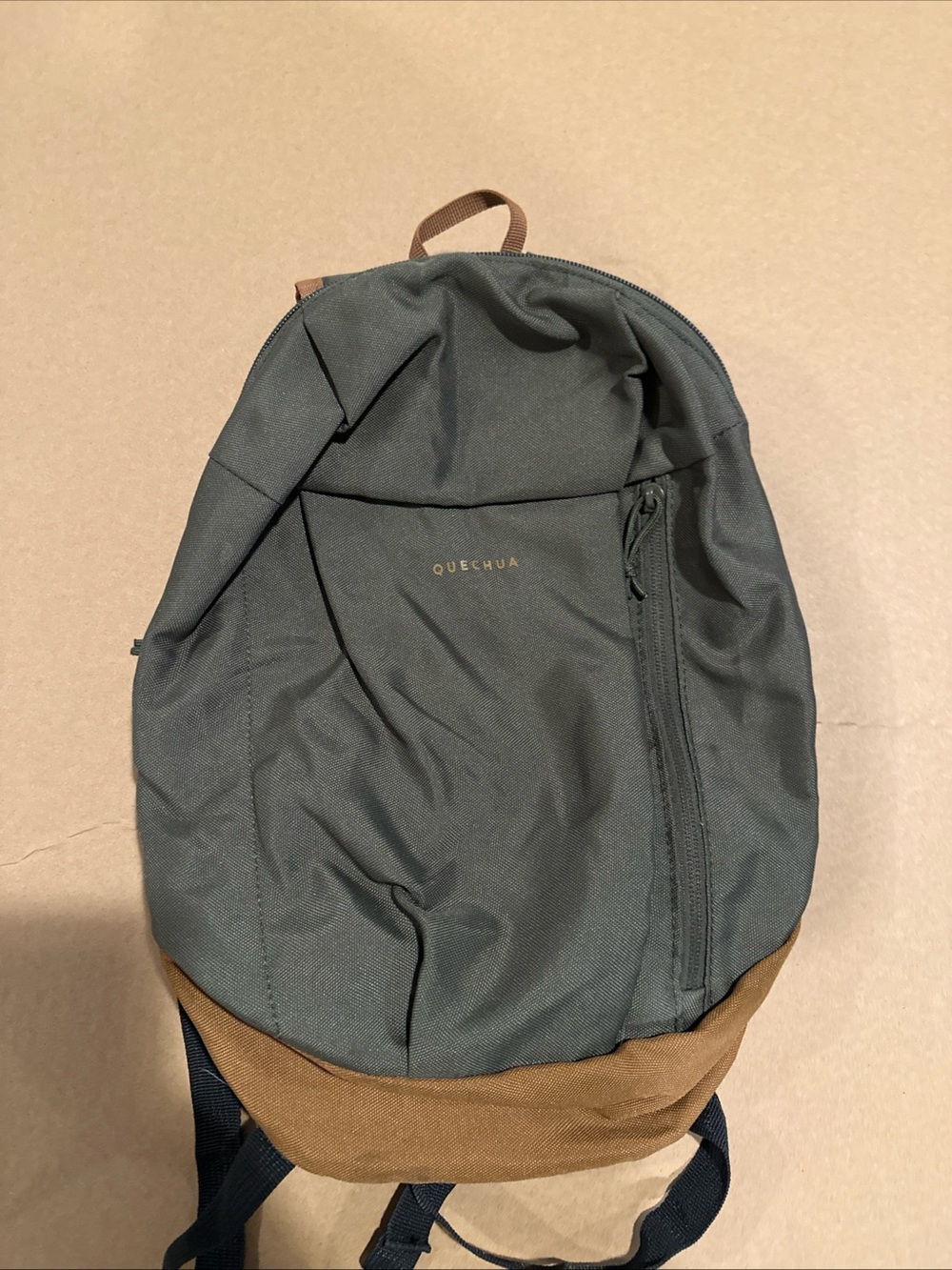 Quechua Green Backpack with Brown Base